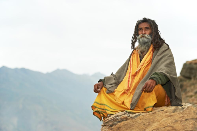 Guru sitting on a USA mountaintop